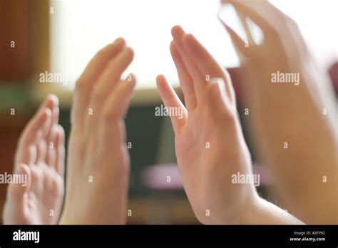 Two girls playing hand clapping game at school Stock Photo - Alamy