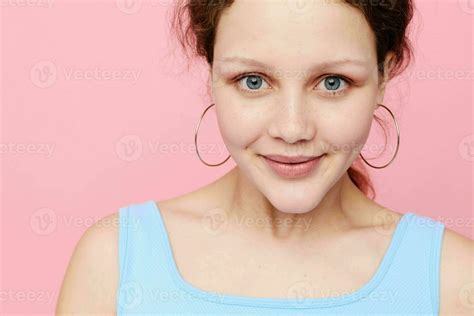 portrait of a young woman blue t shirt hand gestures emotion isolated backgrounds unaltered ...