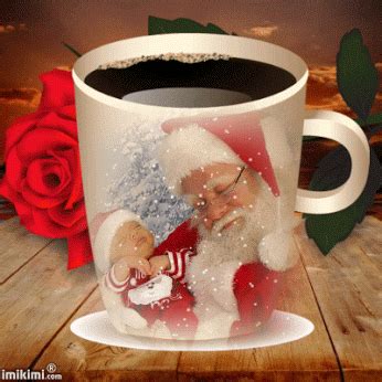 a coffee mug with santa claus on it and a red rose in the foreground
