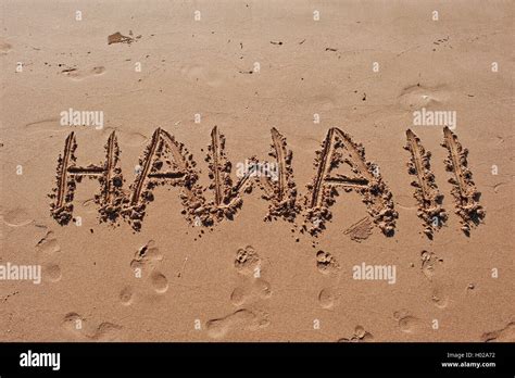 "Hawaii" written in the sand on the beach Stock Photo - Alamy