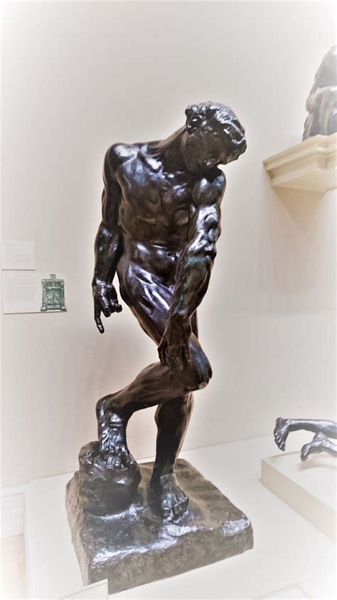 a bronze statue is on display in a museum