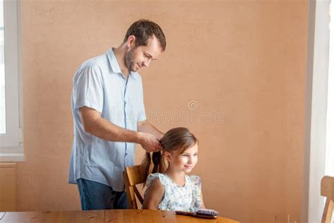 At Home, Father Brushes His Daughter`s Hair Stock Photo - Image of hairstyle, fatherhood: 228245944