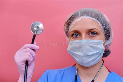 Portrait of a Doctor Woman in a Medical Cap with a Stethoscope, Closeup. Nurse in a Blue Uniform ...