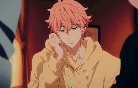 an anime character with red hair wearing a yellow hoodie and holding his hand up to his face