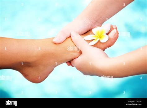 Foot massage and spa foot treatment Stock Photo - Alamy