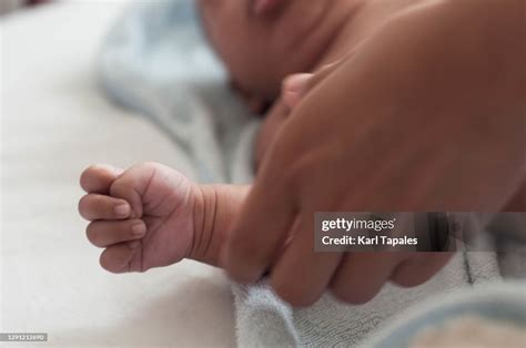 Southeast Asian Baby Boy Changing Clothes High-Res Stock Photo - Getty Images