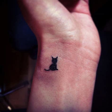 Cute wrist cat tattoo | Black cat tattoos, Tattoos, Wrist tattoos