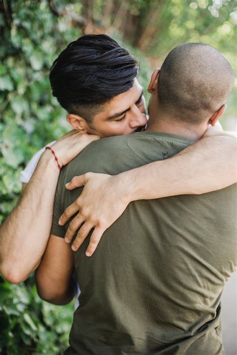 Two Men Hugging · Free Stock Photo