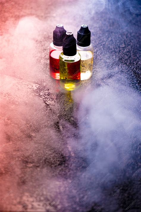 Premium Photo | Vape concept smoke clouds liquid bottles