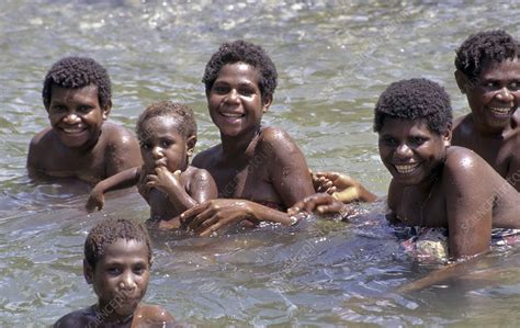 Bathing in a river, Papua New Guinea - Stock Image - C008/4010 - Science Photo Library
