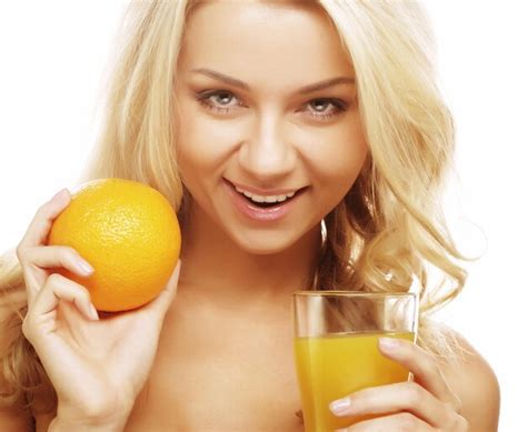 Premium Photo | Woman holding orange juice
