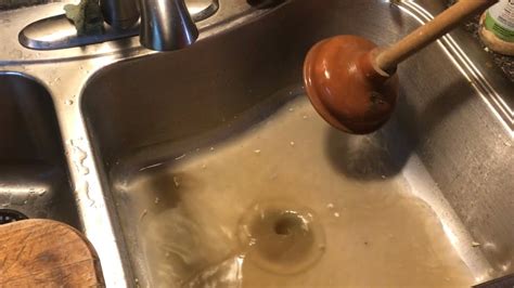 “unclogging” kitchen sink with a PLUNGER (try easiest solution first ...