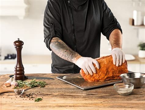 Free Photo | Man cooking meat steak on kitchen