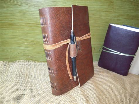 Front of journal with pen holder | Leather journal, Handmade leather journal, Leather handmade