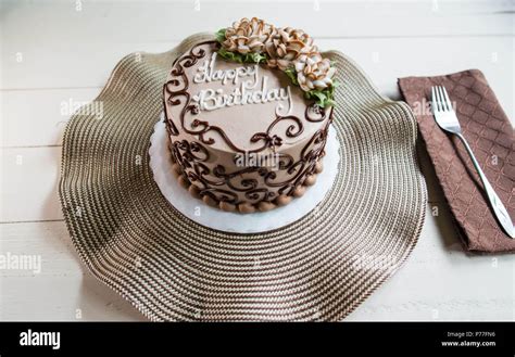 Chocolate happy birthday cake with flowers Stock Photo - Alamy