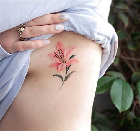 Pink lily tat by tattooist Franky | Lily tattoo, Lily flower tattoos, Tattoos for women