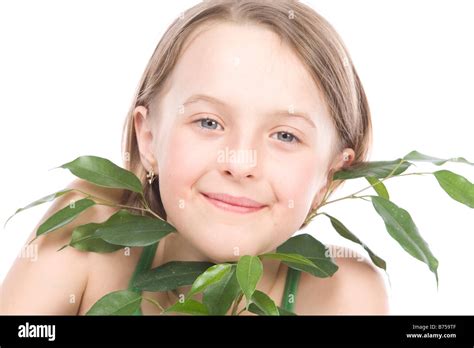 9 year old girl with the green leaves under her chin, Winnipeg, Manitoba Stock Photo - Alamy