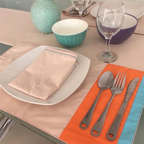 a table set with silverware and utensils
