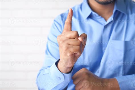 Young man's index finger pointing up 2751665 Stock Photo at Vecteezy