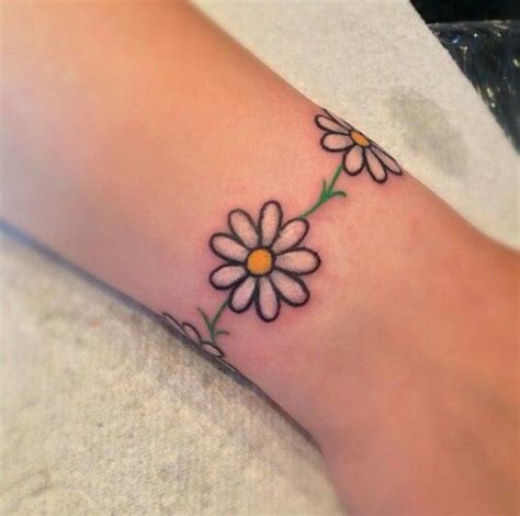 White Daisy Flower Tattoo On Ankle | Daisy chain tattoo, Anklet tattoos ...