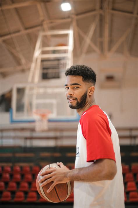 Brown Basketball on Grey Floor · Free Stock Photo