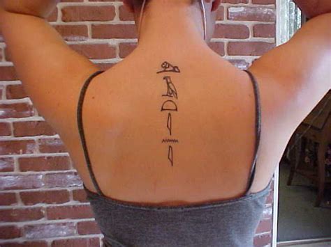 Egyptian hieroglyphics tattoo - but I would get it lower on my spine ...