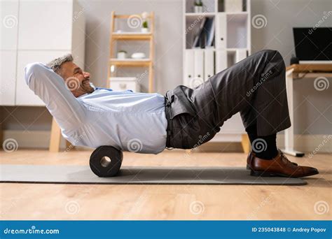 Foam Roller Back Pain Treatment Stock Photo - Image of floor, employee ...