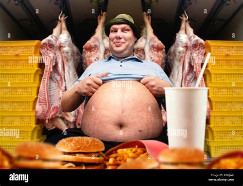 Happy fat man and fast food, pork carcasses on background. Overweight ...