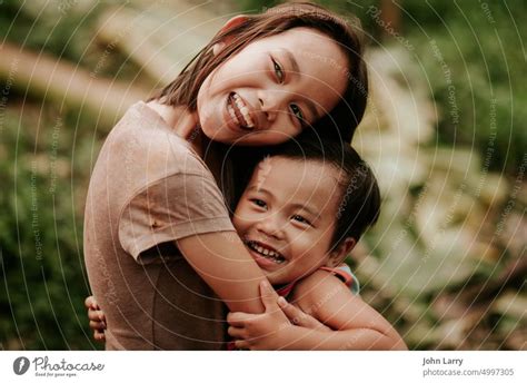 siblings Sister hug - a Royalty Free Stock Photo from Photocase