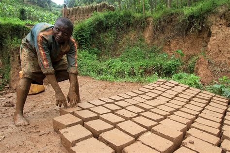 Mud Bricks | A teenage brick-maker places a fresh mud brick … | Flickr