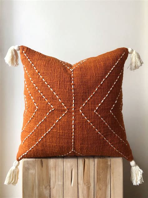 Burnt Orange Pillow with Tassels. Organic Natural Raw Cotton. Hand-dyed rust colour with stitch ...