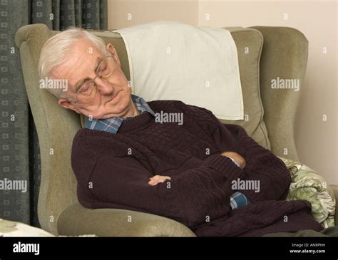 Old Man Sleeping In Recliner