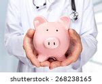 Doctor With Money-box Free Stock Photo - Public Domain Pictures