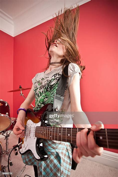 Young Girl Playing Electric Guitar High-Res Stock Photo - Getty Images