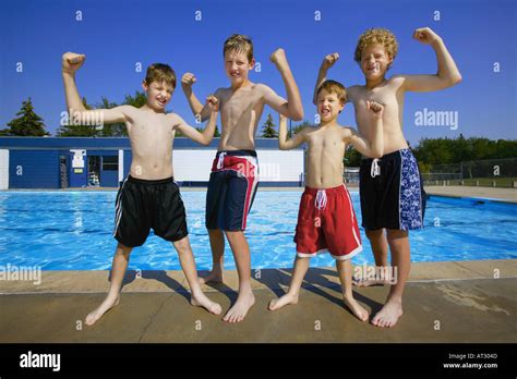 Kids flexing muscles Stock Photo - Alamy