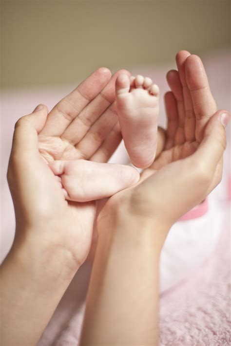 Baby Legs In Mother's Arms Free Stock Photo - Public Domain Pictures