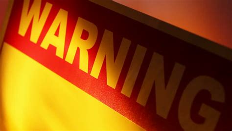 A Close Up Of A Warning Sign With Flashing Lights Reflecting On The Sign Stock Footage Video ...