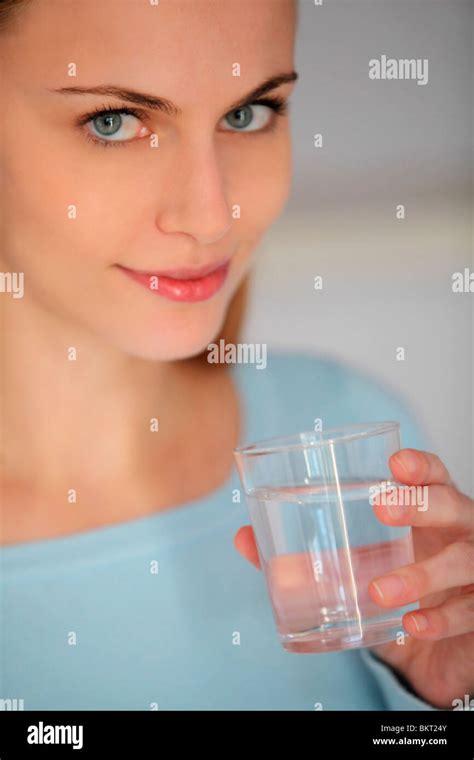 young woman drinking water Stock Photo - Alamy