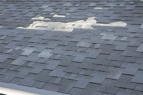 A Close Up View of Shingles a Roof Damage. Roof Shingles - Roofing. Stock Image - Image of ...