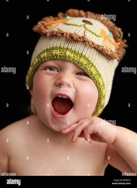 Baby girl in lion hat Stock Photo - Alamy