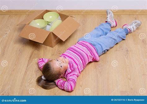 Little Girl Lying On The Floor Stock Photo - Image of moving, decoration: 26732116