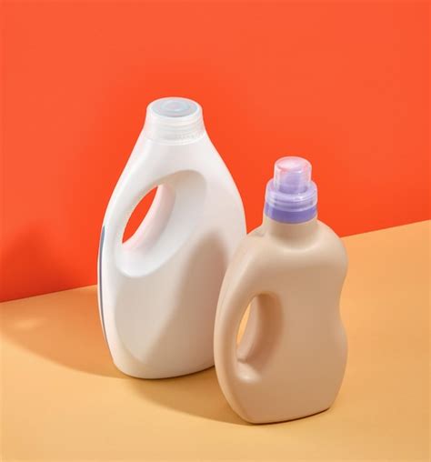 Premium Photo | Large and medium sized bottles of liquid laundry detergent for washing colored ...