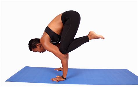 African woman doing beginner handstand yoga pose