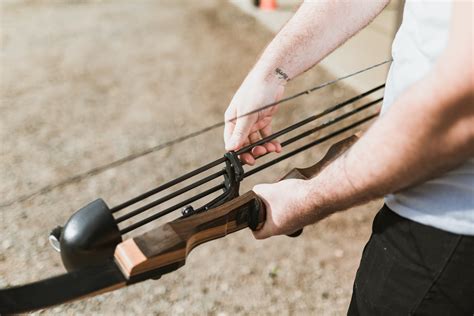 Beautiful Woman Shooting a Bow and Arrow · Free Stock Photo