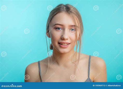 Happy Young Woman Wearing Her Hair Tied Being Glad To Positive News, Looking at Camera with ...