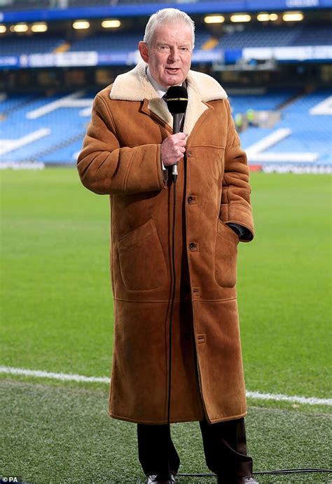 Lily James channels legendary football commentator John Motson in full-length sheepskin coat ...