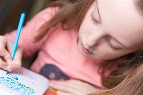 Little girl drawing stock photo. Image of coloring, writing - 245489464