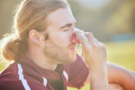 Premium Photo | Nose bleed man closeup and sports injury closeup on ...