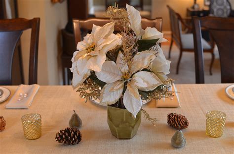 Christmas centerpiece: white poinsettia, pinecones, and pears ...