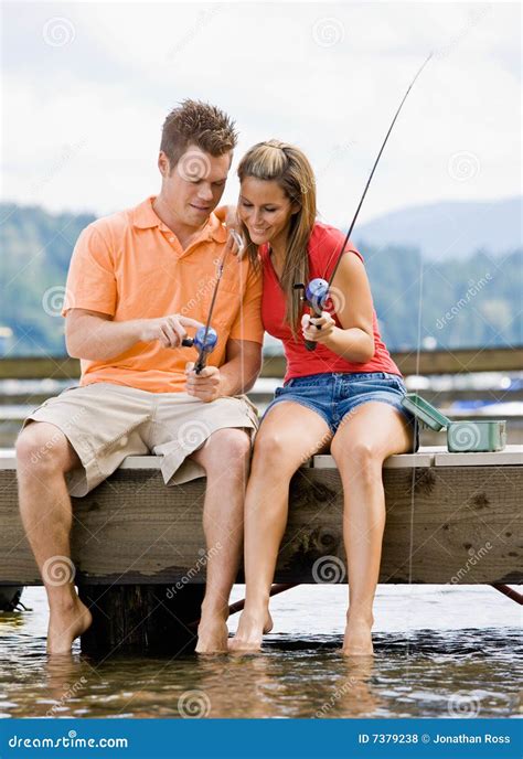 Couple Fishing On Pier Stock Image | CartoonDealer.com #7379233